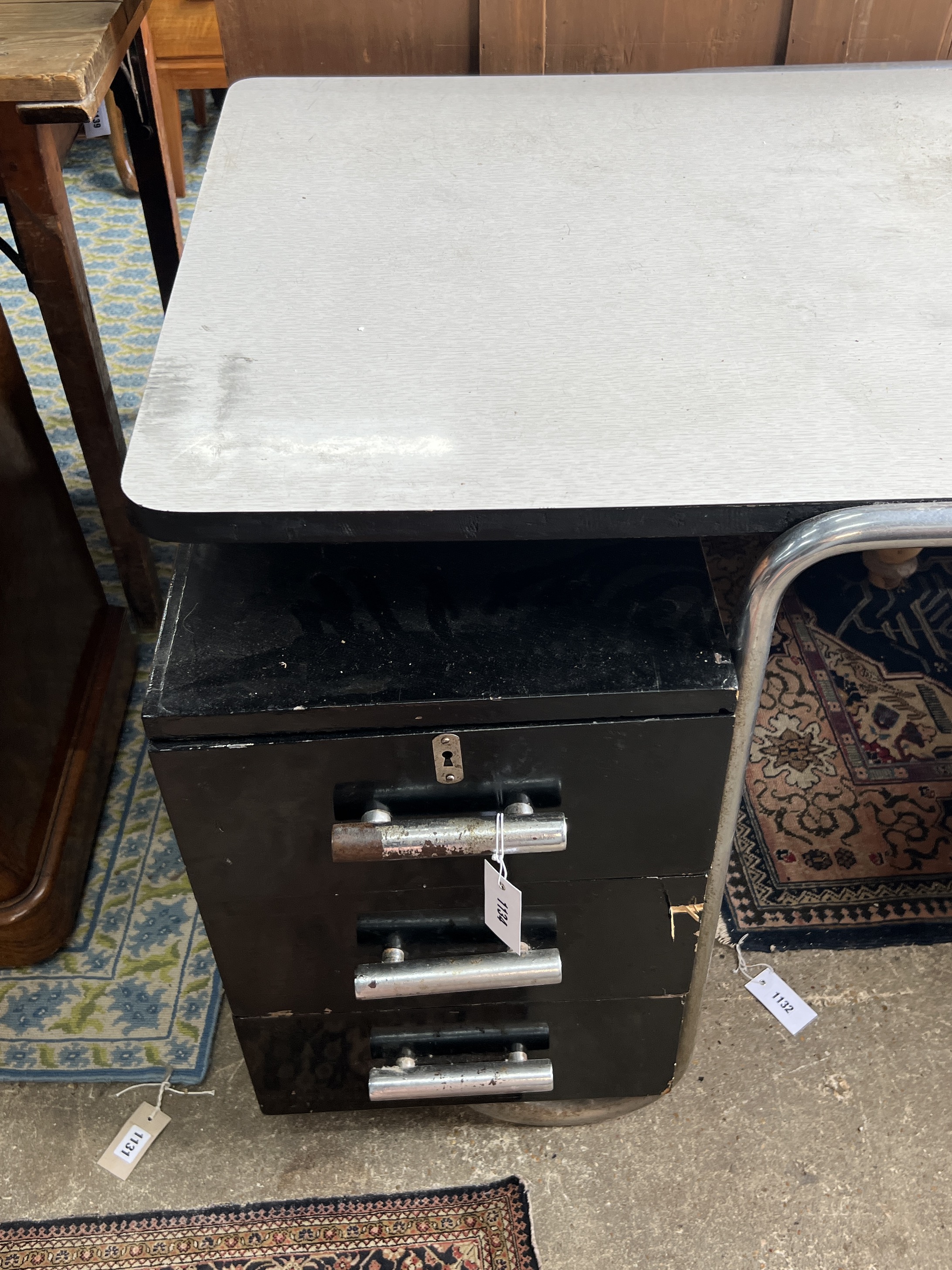 A mid century industrial style kneehole desk, width 152cm, depth 76cm, height 74cm
